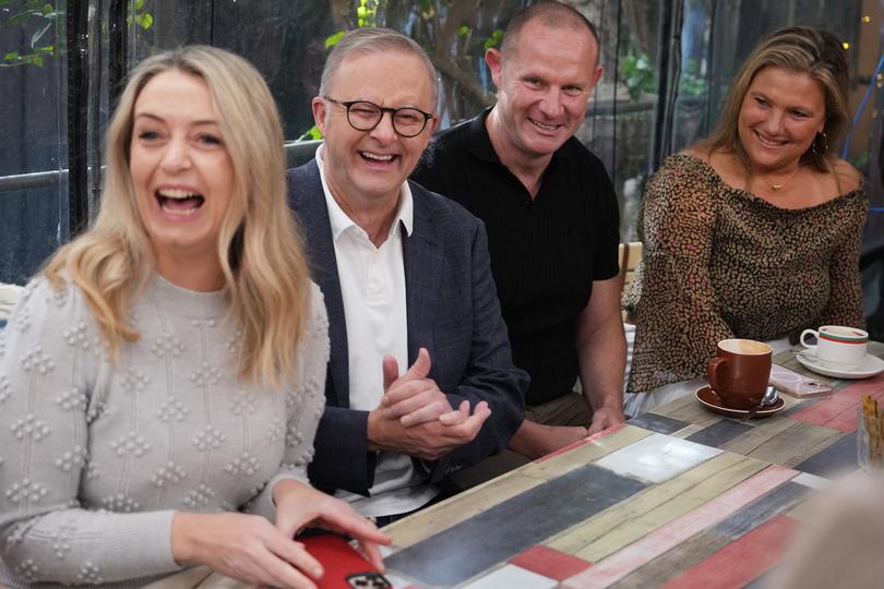 Minister Anthony Albanese and fiancée Jodie Haydon visits a cafe the day after Labor’s crushing victory.
