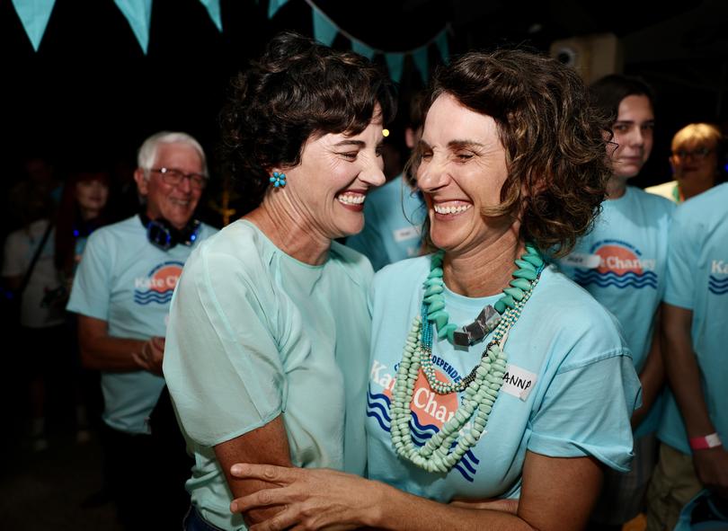 Independent for Curtin Kate Chaney, left, with her sister Anna, arrives at her Federal Election night function at UWA.