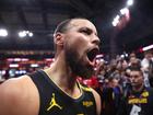 Stephen Curry celebrates after Golden State beat the Rockets.