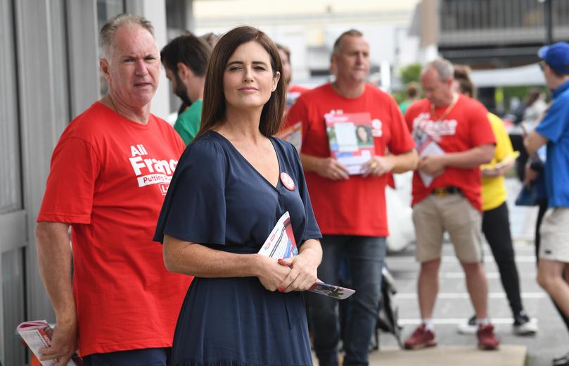 Labor candidate Ali France (centre) is seen at the Strathpine Australian Electoral Commission early voting centre in the Federal electorate of Dickson in Brisbane.