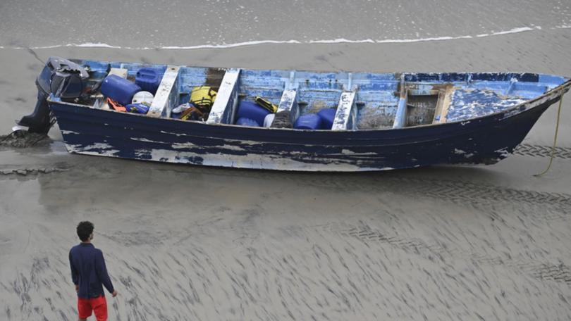 Four people were rescued after the "panga"-style open fishing vessel washed ashore near San Diego.