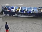 Four people were rescued after the "panga"-style open fishing vessel washed ashore near San Diego.