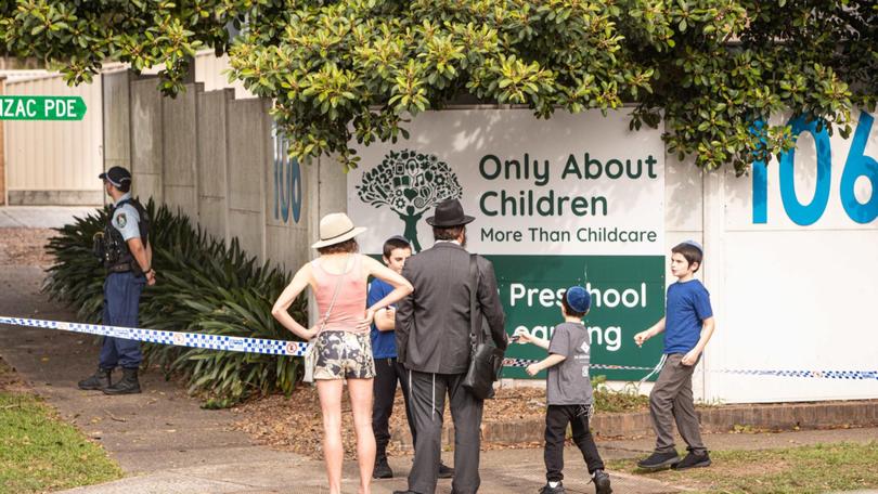 Members of the local Jewish community in Maroubra arrive with their children at the childcare centre which was firebombed in an anti-Semitic attack.