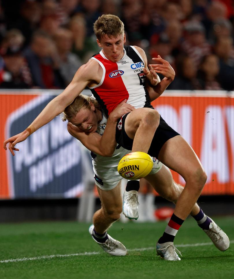 Liam O'Connell of the Saints is tackled by Hayden Young.
