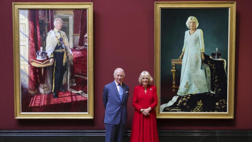 King Charles and Queen Camilla unveiled their coronation portraits at London's National Gallery.