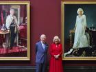King Charles and Queen Camilla unveiled their coronation portraits at London's National Gallery.