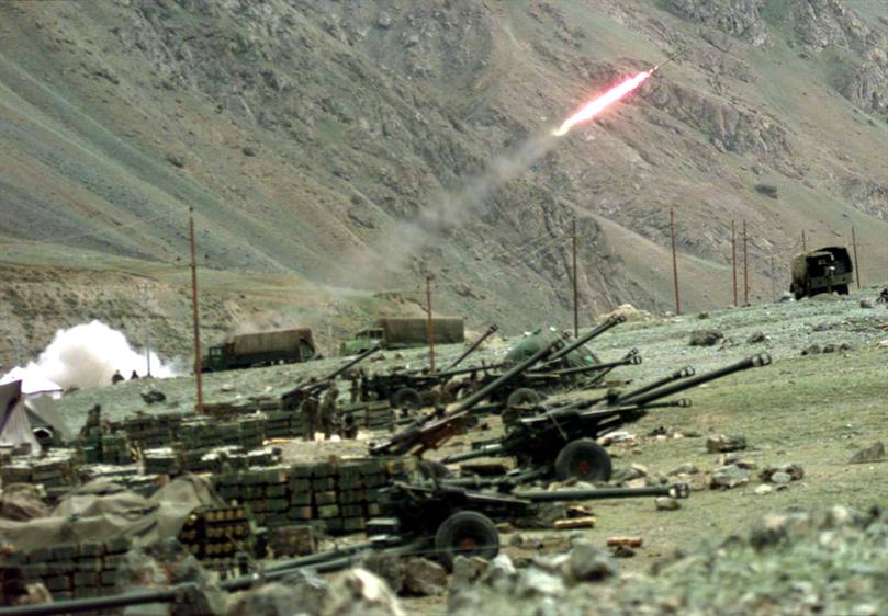 A rocket is fired at a bunker of Islamic infiltrators who have occupied critical positions inside the Indian state of Kashmir, along the line of control that India shares with Pakistan on Monday, June 14, 1999.