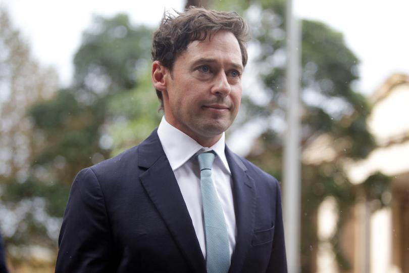 Nick McKenzie leaves the Federal Court in Sydney.
