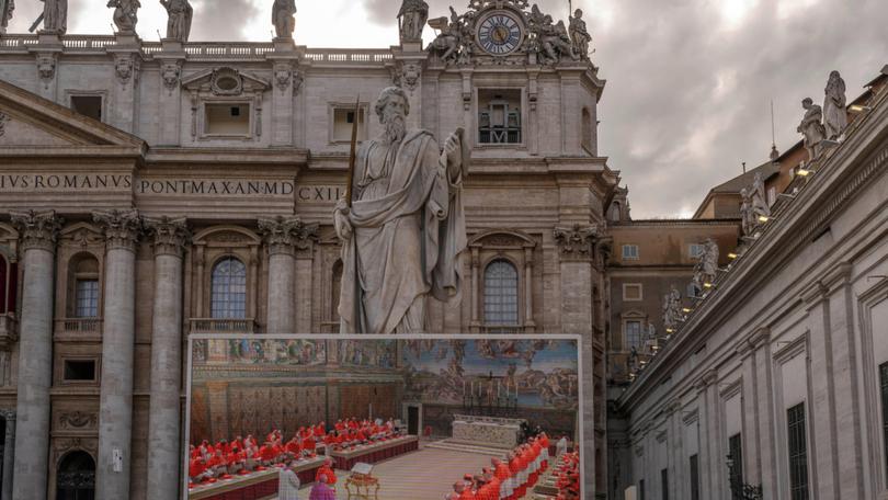 St Peter's Basilica with a large screen showing the Cardinals prior to the start of the conclave to elect the next pope on May 7.