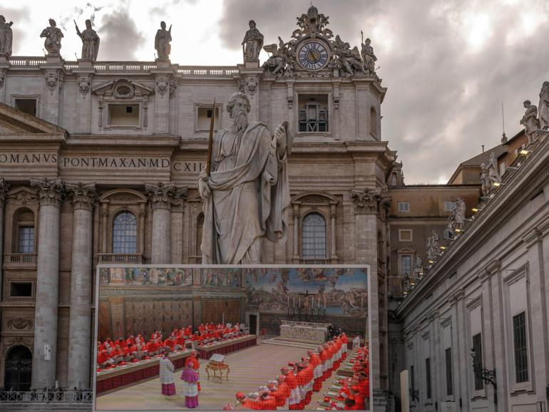 St Peter's Basilica with a large screen showing the Cardinals prior to the start of the conclave to elect the next pope on May 7.