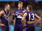 Sean Darcy Dockers talks with Brennan Cox and Luke Ryan after being defeated.