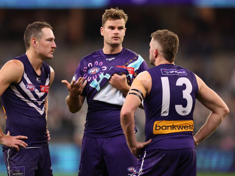 Sean Darcy Dockers talks with Brennan Cox and Luke Ryan after being defeated.