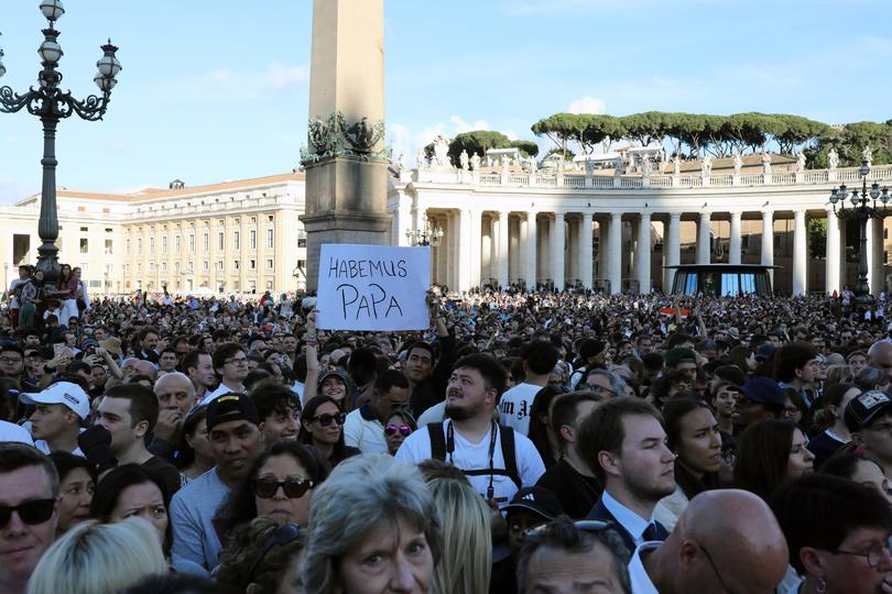 A group of religious people react with emotion to the election of the new Pope Leo XIV in St.Peter's square during the second day of Conclave on May 8, 2025 in Vatican City, Vatican.