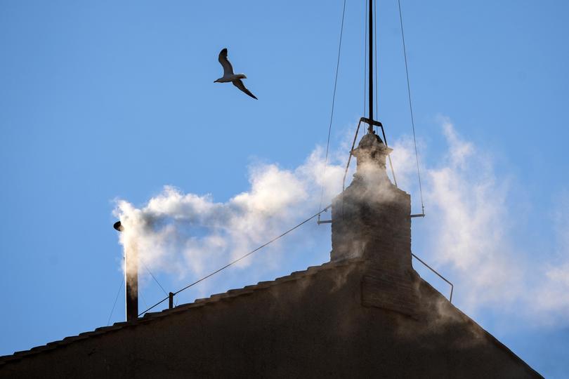 VATICAN CITY, VATICAN - MAY 08: White smoke rises from the chimney on the roof of the Sistine Chapel indicating that the College of Cardinals have elected a new Pope during their fourth vote on the second day of their secret conclave on May 8, 2025 in Vatican City, Vatican. White smoke was seen over the Vatican early this evening as the Conclave of Cardinals took just two days to elect Cardinal Robert Francis Prevost, who will be known as Pope Leo (Leone) XIV, as the 267th Supreme Pontiff after the death of Pope Francis on Easter Monday. (Photo by Christopher Furlong/Getty Images) Picture: Christopher Furlong