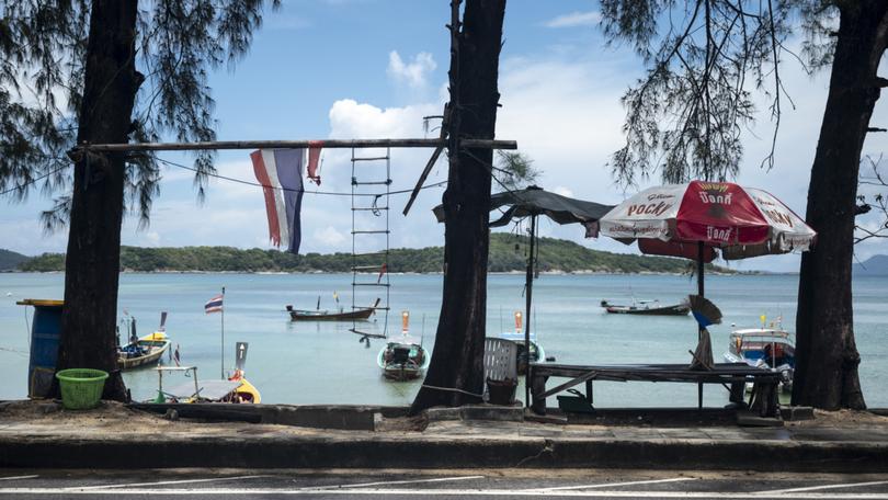 The seven foreigners exploring the coast of Ko Racha Yai.