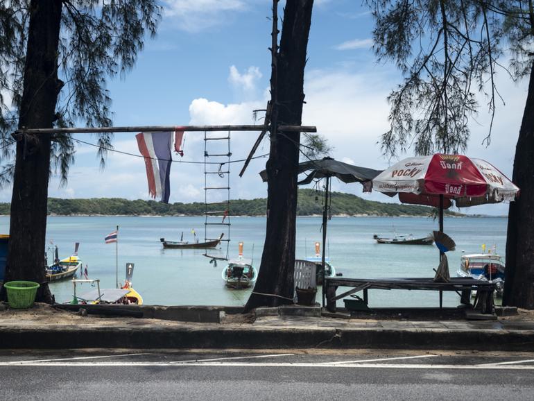 The seven foreigners exploring the coast of Ko Racha Yai. 
