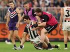 Lachie Schultz attempts to get up after his hit.