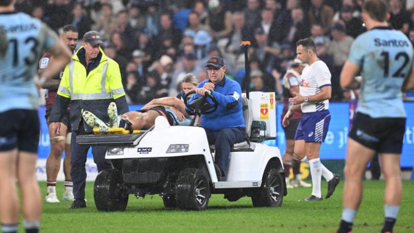 Joseph-Aukuso Suaalii has been stretchered off in the Waratahs' clash with the Queensland Reds. (Dean Lewins/AAP PHOTOS)