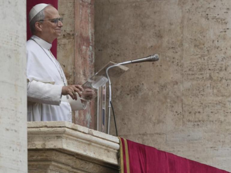 Pope Leo XIV has appeared at St Peter's Basilica's central balcony for his first Sunday blessing. 