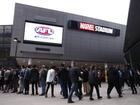 A teenage boy has been given a caution after trying to take a knife and fake gun into an AFL game.