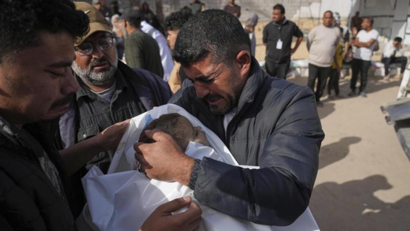 Two children were among those killed in an Israeli air strike in Khan Younis, in southern Gaza. (AP PHOTO)