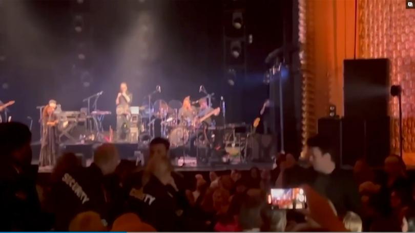 A man and a woman hurled abuse at each other at the show, forcing Tina Arena to stop her show.