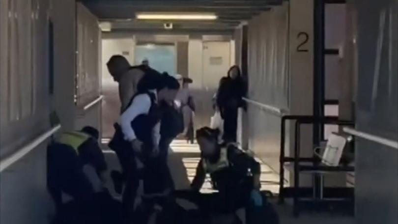 A 15-year-old boy is in hospital under police guard and a 16-year-old has been arrested following a fight at Watergardens shopping centre that allegedly involved machetes. 7News