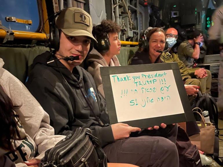 Edan Alexander was returned safely and held up a sign thanking Donald Trump.