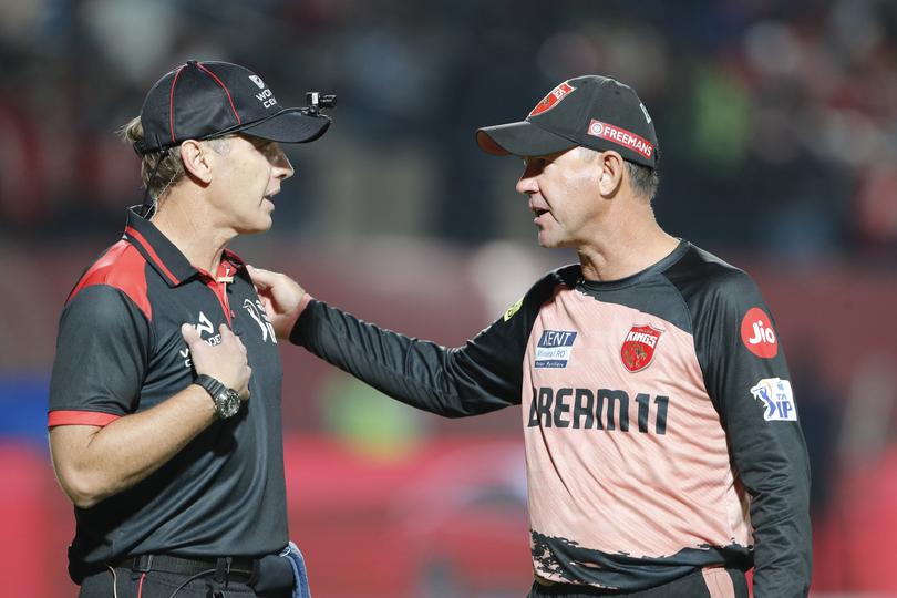 Ricky Ponting talks to an umpire at the Himachal Pradesh Cricket Association Stadium in Dharamsala, India., last week.