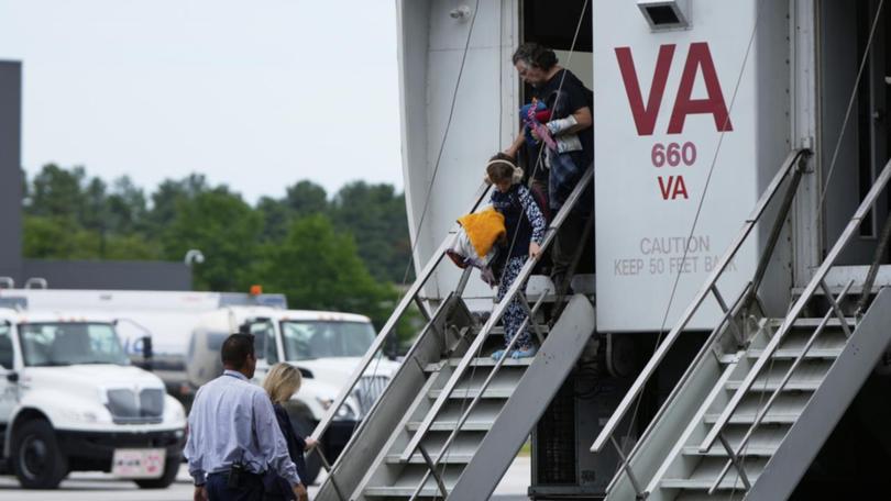 Refugees have arrived in the US from South Africa over what President Donald Trump calls genocide. (AP PHOTO)