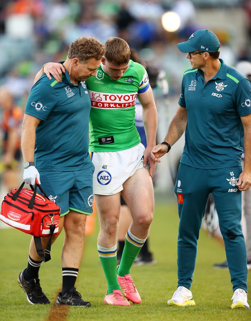 Matty Nicholson of the Raiders is helped from the field with an injury during the match against the Canterbury Bulldogs at GIO Stadium on Saturday.