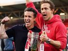 Wrexham AFC owners Rob McElhenney and Ryan Reynolds celebrate the club's latest promotion last month.