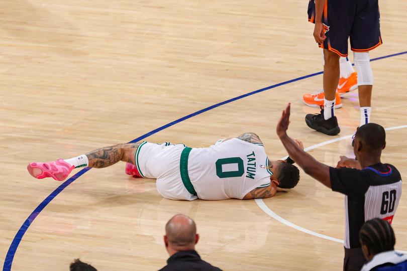 Jayson Tatum writhes in pain after badly injuring his ankle.