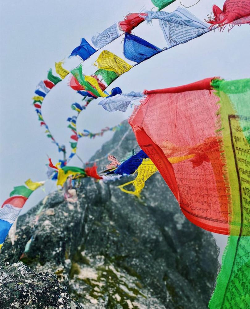 Prayer flags on the hiking route to Everest Base Camp in the Khumbu Pasang Lhamu rural municipality in the Nepalese Himalayas.