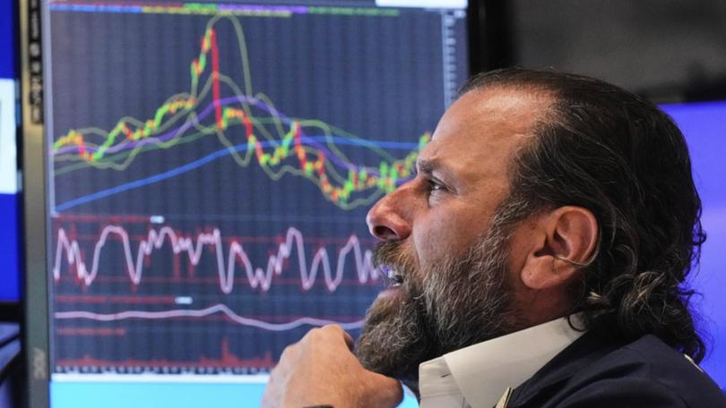 US stocks closed higher, buoyed by soft inflation data and China trade optimism. (AP PHOTO)