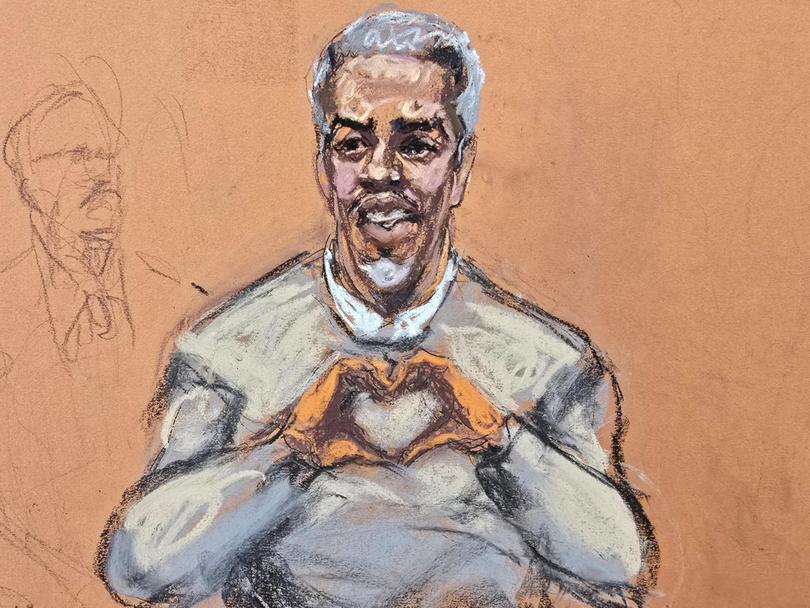 Sean "Diddy" Combs makes a hand gesture to family members arriving at his sex trafficking trial in New York City.
