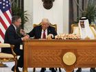 President Donald Trump, (C), Qatar's Emir Sheikh Tamim bin Hamad Al Thani and Kelly Ortberg, President and Chief Executive Officer, The Boeing Company, left, at a signing ceremony at the Amiri Diwan in Doha, Qatar.