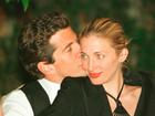 John F. Kennedy, Jr. editor of George magazine, gives his wife Carolyn Bessette Kennedy a kiss on the cheek during the annual White House Correspondents dinner May 1, 1999 in Washington, D.C. 