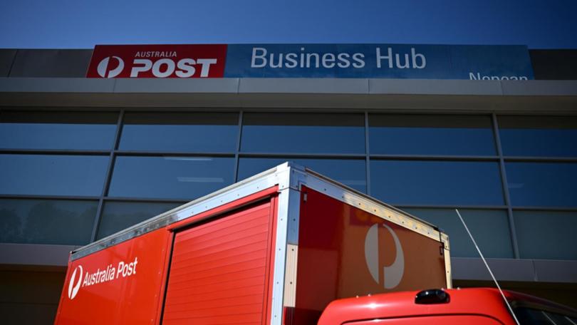 Scam text messages and emails claim an Australia Post delivery failed due to an invalid postcode. (Dan Himbrechts/AAP PHOTOS)