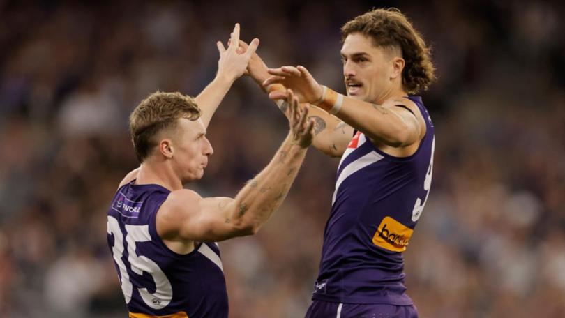 Melbourne coach Simon Goodwin says he would love to see Luke Jackson (r) return to the Demons. (Richard Wainwright/AAP PHOTOS)