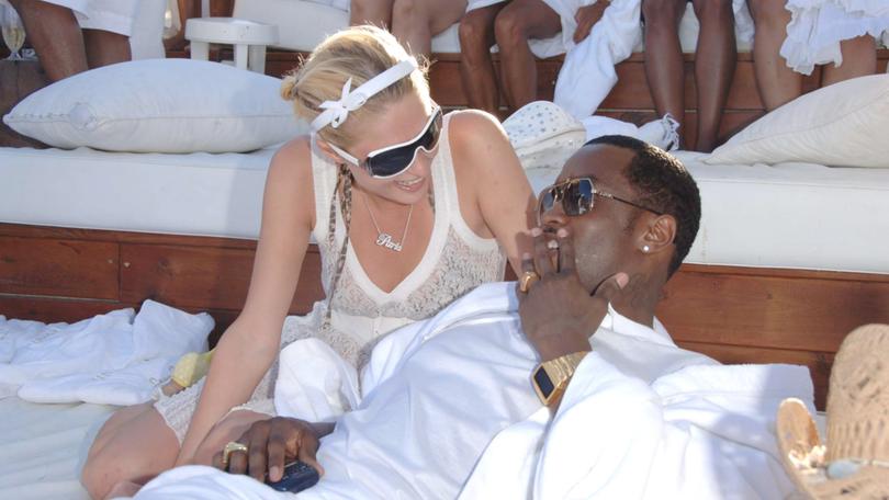 Paris Hilton with the host at one of the White parties
