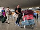 South African refugee Charl Kleinhaus, right, arrives at Dulles International Airport in Virginia on Monday. MUST CREDIT: Craig Hudson/For The Washington Post Craig Hudson