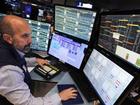 Investors on Wall Street are awaiting comments from at least two Federal Reserve members. (AP PHOTO)