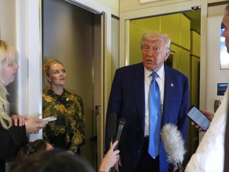 President Donald Trump says US officials will not be able to meet with delegations of 150 countries. (AP PHOTO)