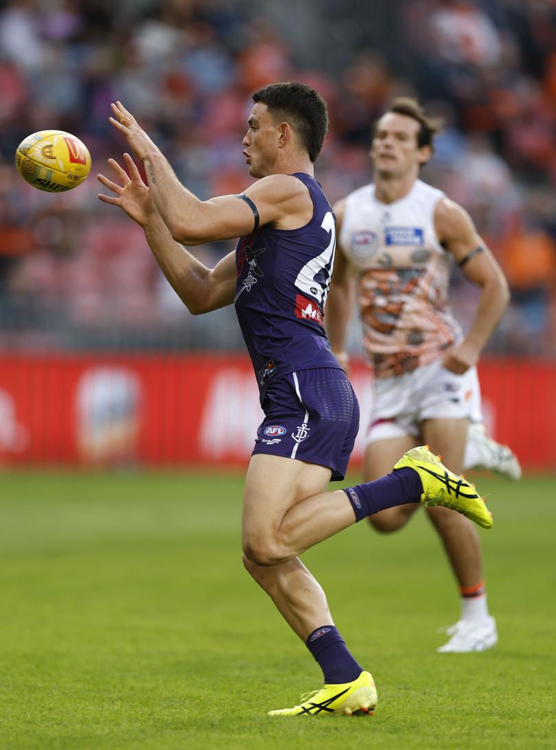 SYDNEY, AUSTRALIA - MAY 17: Patrick Voss of the Dockers gathers the ball during the round ten AFL match between GWS Giants v Walyalup (Fremantle Dockers) at ENGIE Stadium, on May 17, 2025, in Sydney, Australia. (Photo by Darrian Traynor/Getty Images via AFL Photos)