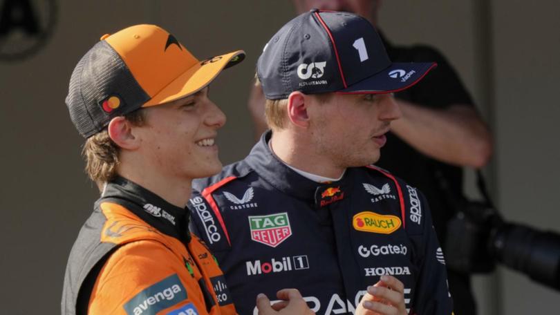 McLaren's Oscar Piastri with Max Verstappen after the Aussie beat the world champ to pole in Imola. (AP PHOTO)
