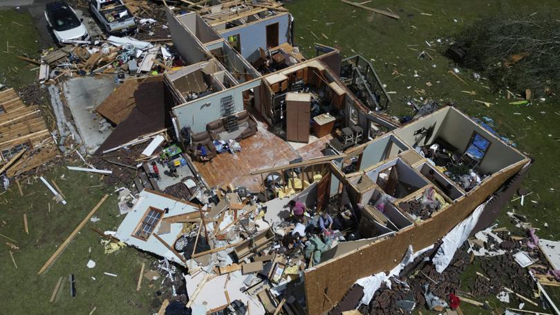 A home is destroyed after a severe storm passed the area on Saturday, May 17, 2025 in London, Ky. (AP Photo/Carolyn Kaster)