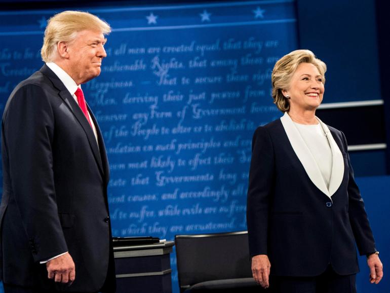 Hillary Clinton and Donald Trump stand onstage for a presidential debate in St. Louis, on Oct. 9, 2016. MUST CREDIT: Melina Mara/The Washington Post)