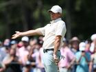 Rory McIlroy reacts to a putt on the ninth green.