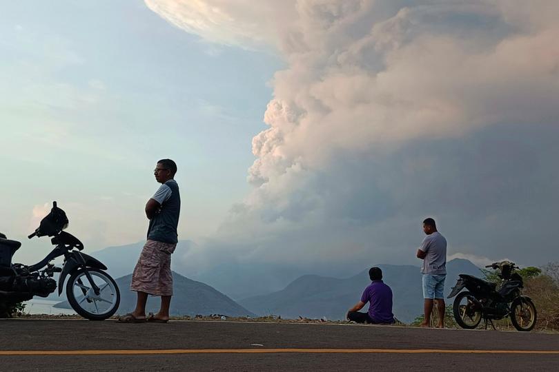 Residents watch as Mount Lewotobi Laki Laki volcano spews volcanic materials during an eruption in East Flores, Indonesia Saturday, Nov, 9, 2024. (AP Photo) Picture: